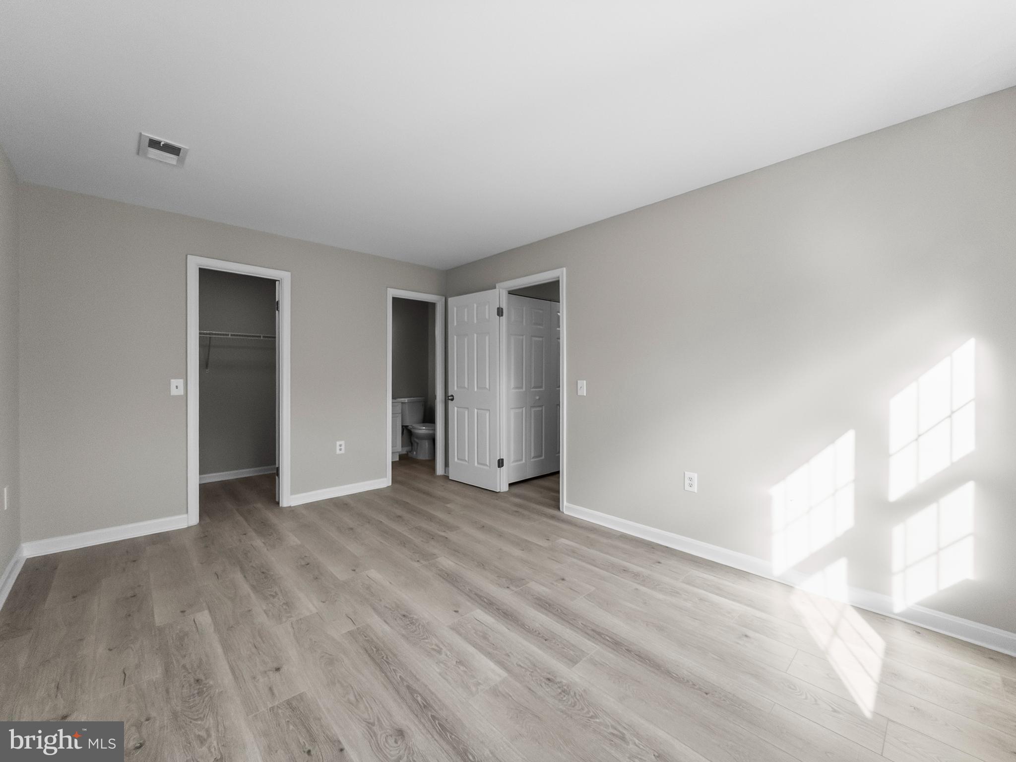 18304 Streamside Drive, Unit 301 Gaithersburg, MD 20879 - Photo 15 of 31 a view of an empty room and window