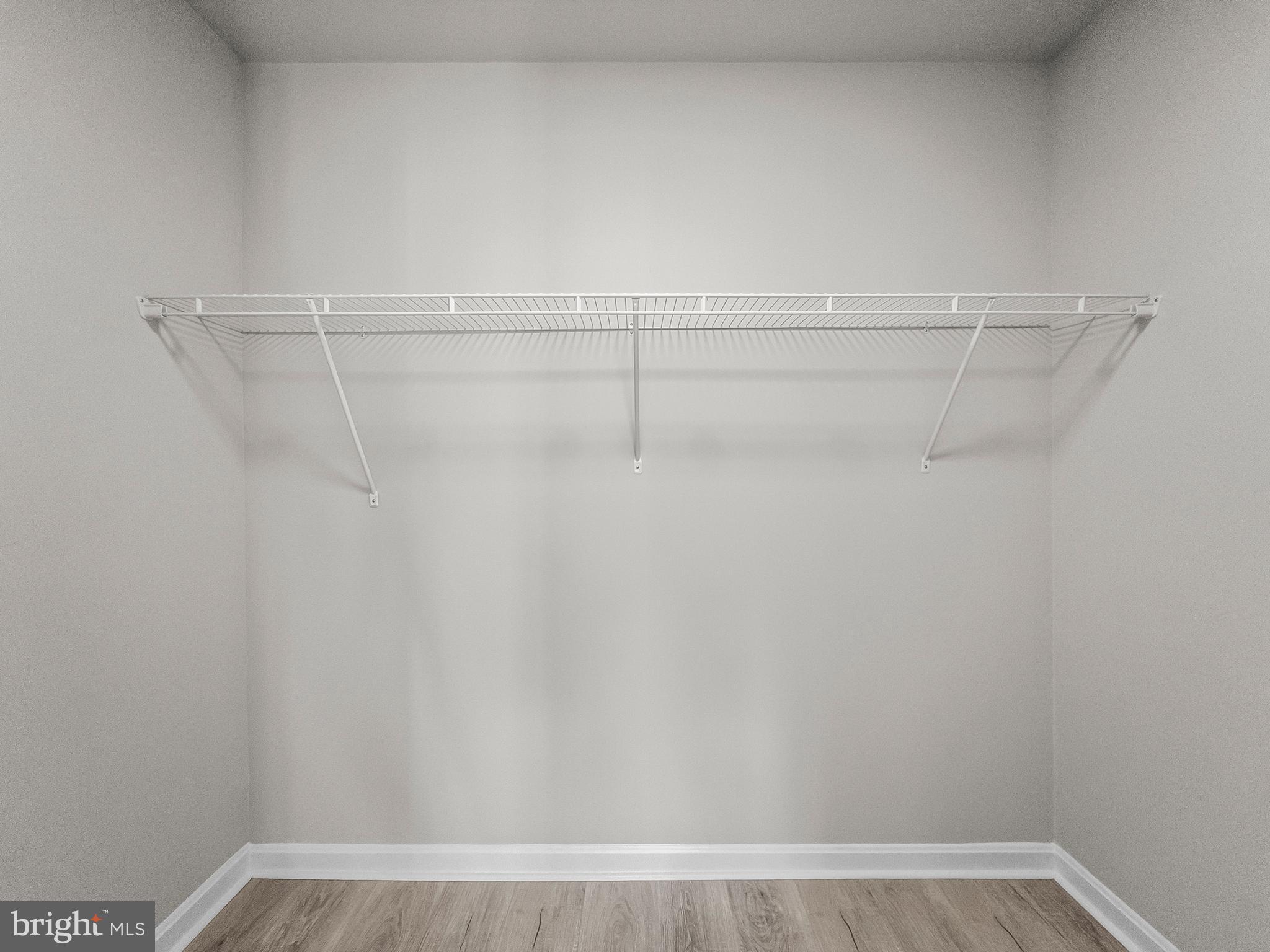 18304 Streamside Drive, Unit 301 Gaithersburg, MD 20879 - Photo 18 of 31 a view of a room with racks on the wall