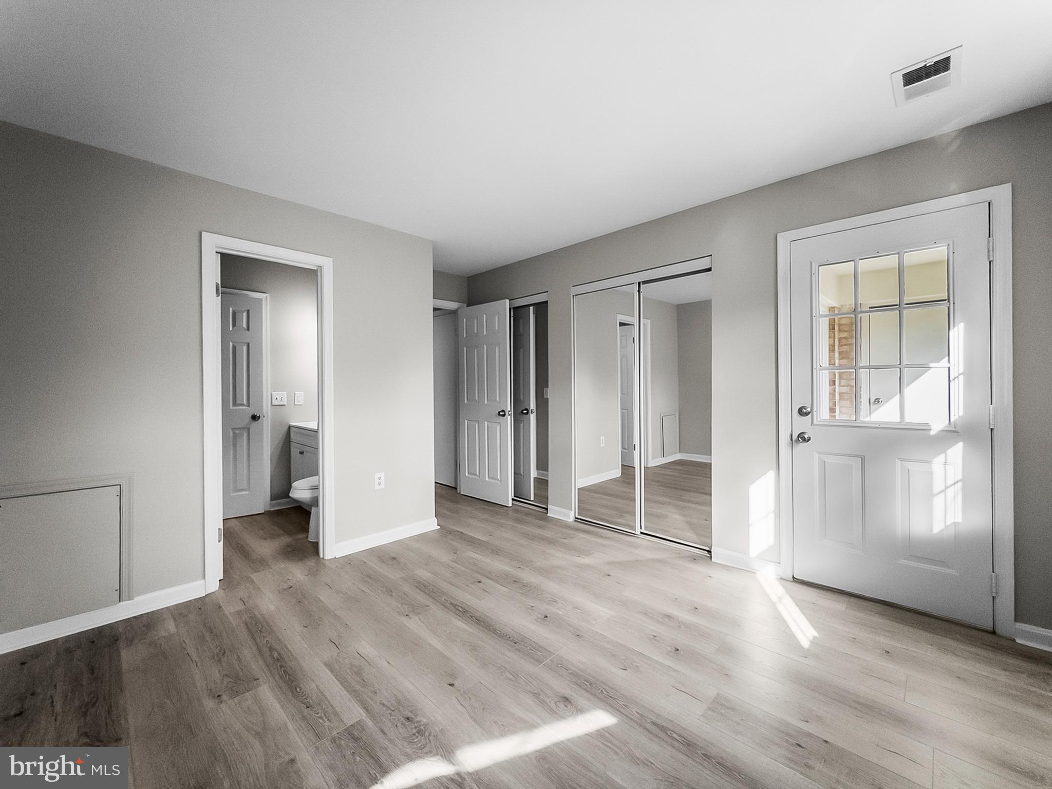 18304 Streamside Drive, Unit 301 Gaithersburg, MD 20879 - Photo 24 of 31 wooden floor in an empty room