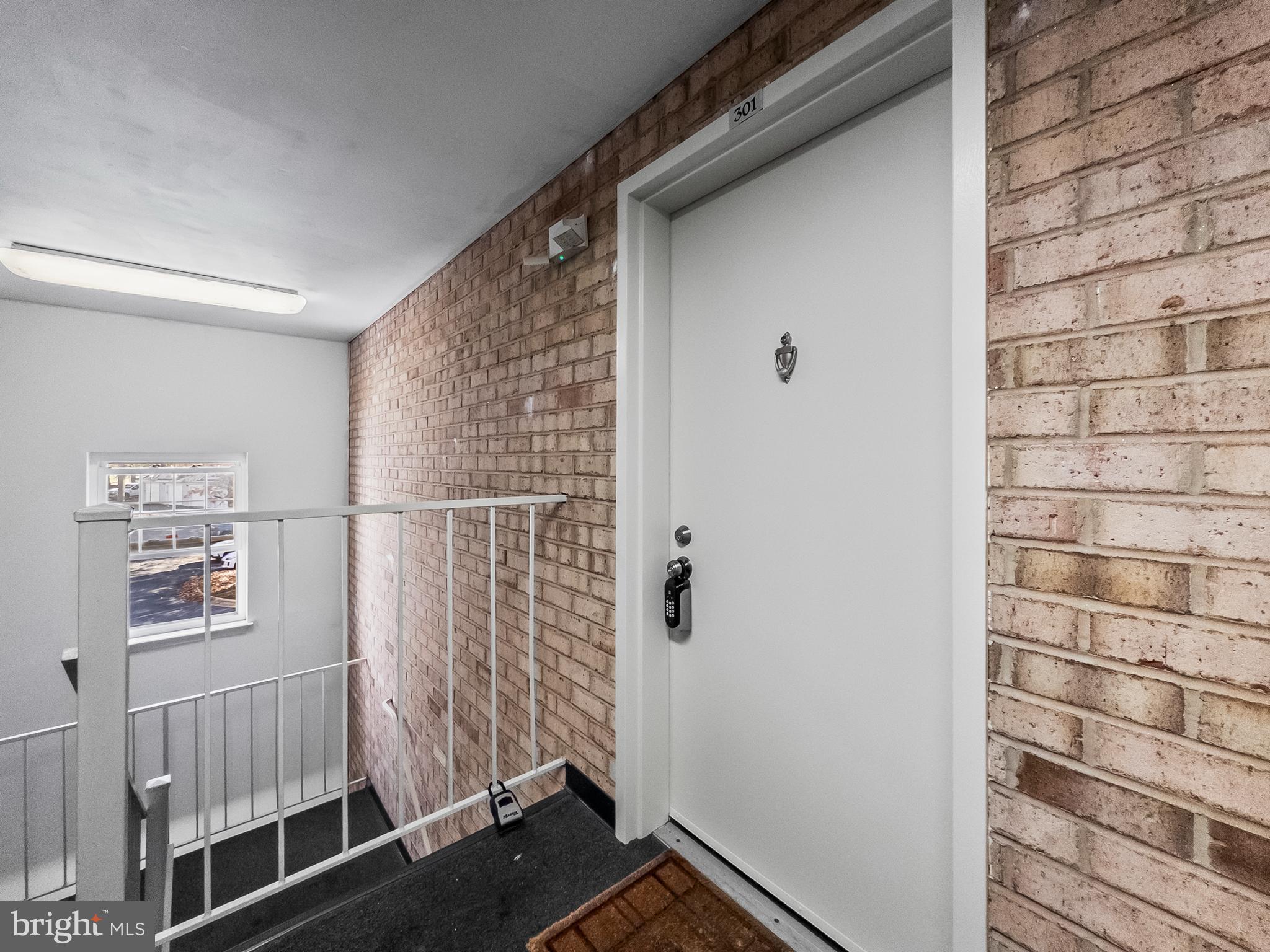 18304 Streamside Drive, Unit 301 Gaithersburg, MD 20879 - Photo 27 of 31 a view of wooden door and wooden floor