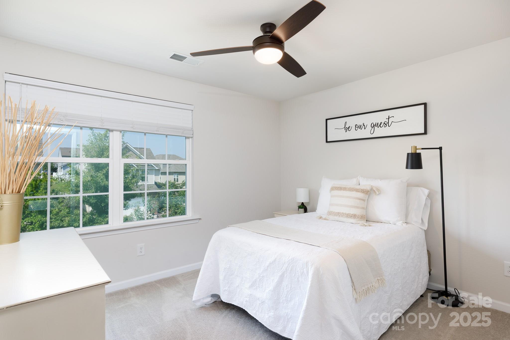 1207 Loggerhead Drive Lancaster, SC 29720 - Photo 18 of 25 a bedroom with a large window and a chandelier