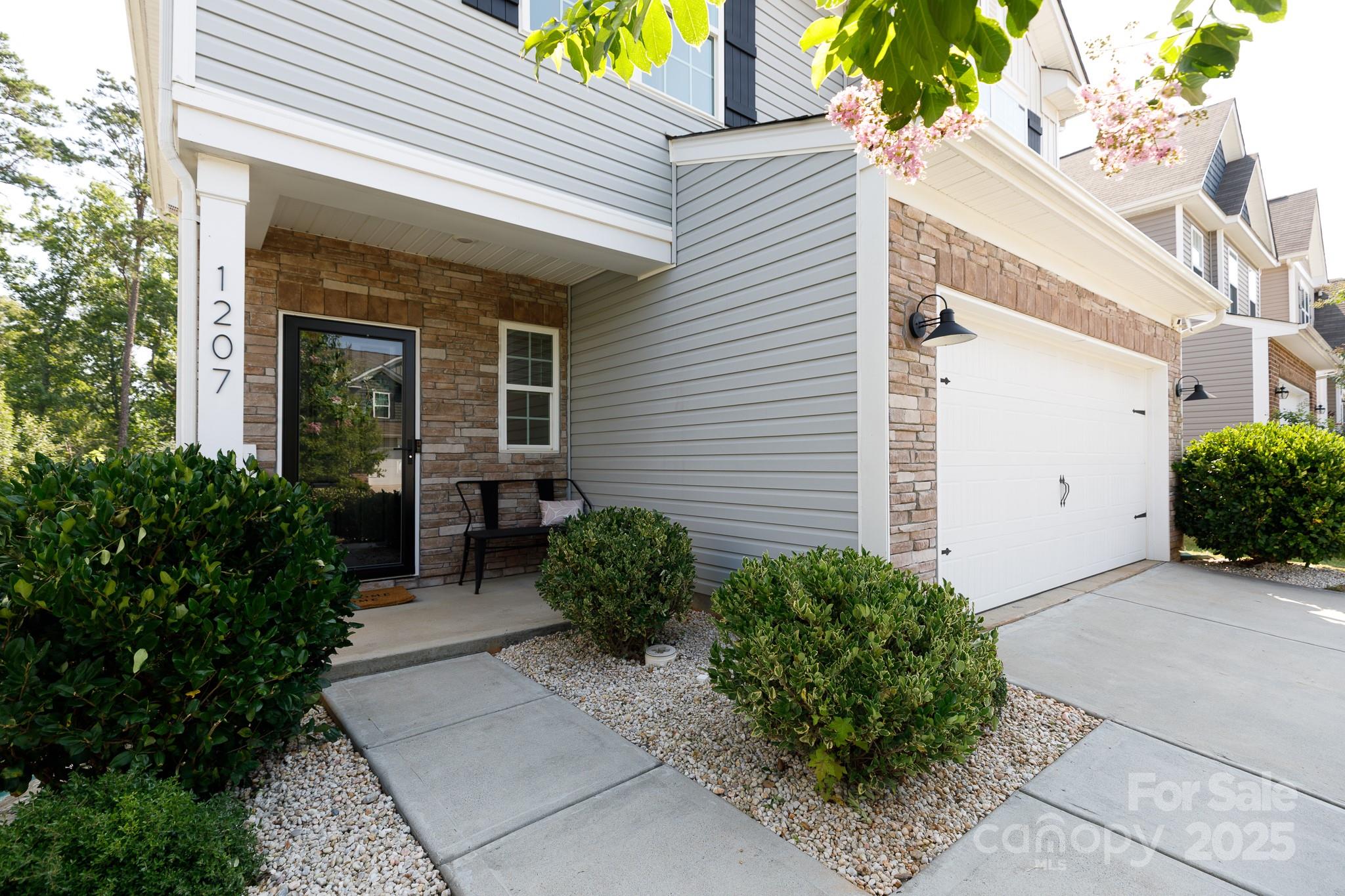 1207 Loggerhead Drive Lancaster, SC 29720 - Photo 2 of 25 a front view of house with potted plants