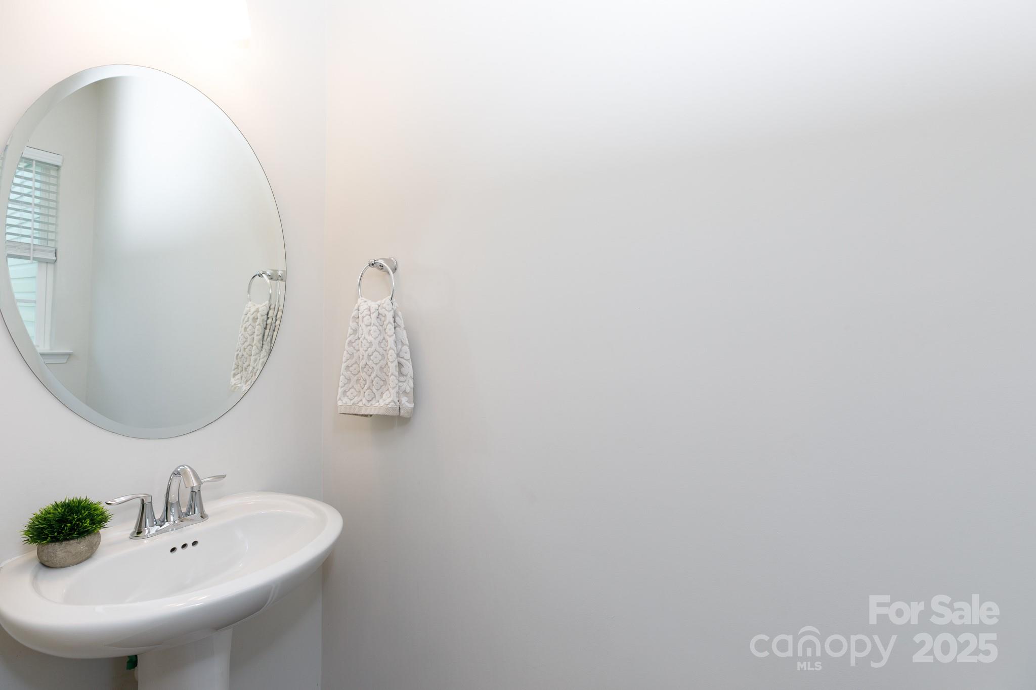 1207 Loggerhead Drive Lancaster, SC 29720 - Photo 10 of 25 a bathroom with a sink and mirror
