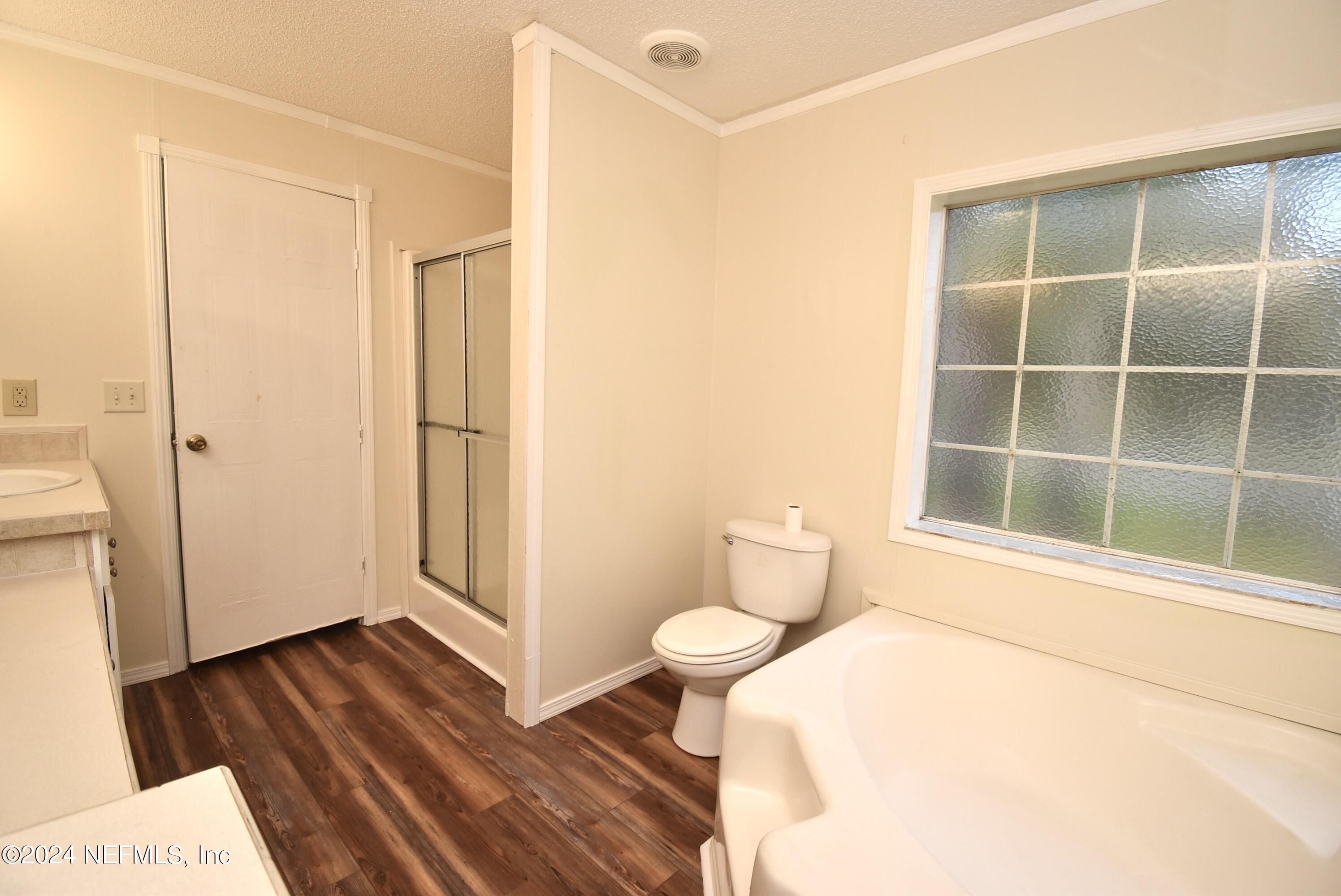 989 Shell Street Welaka, FL 32193 - Photo 22 of 34 a bathroom with a sink and a toilet