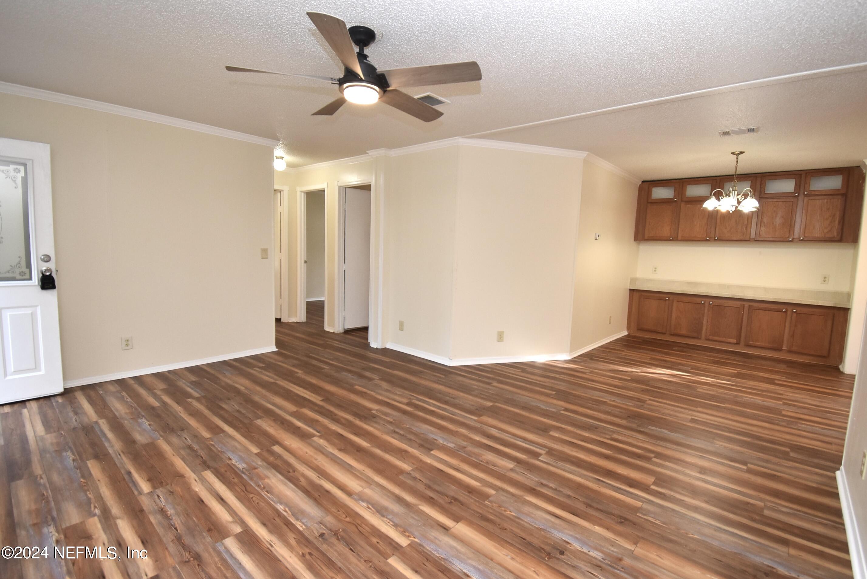 989 Shell Street Welaka, FL 32193 - Photo 8 of 34 a view of a livingroom with wooden floor