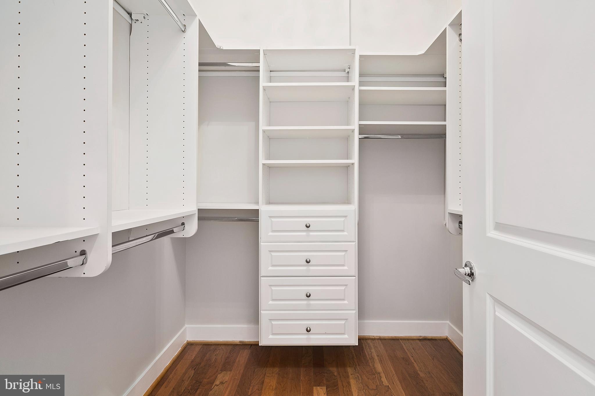 1211 13th Street Northwest, Unit 803 Washington, DC 20005 - Photo 17 of 29 a view of walk in closet with empty racks