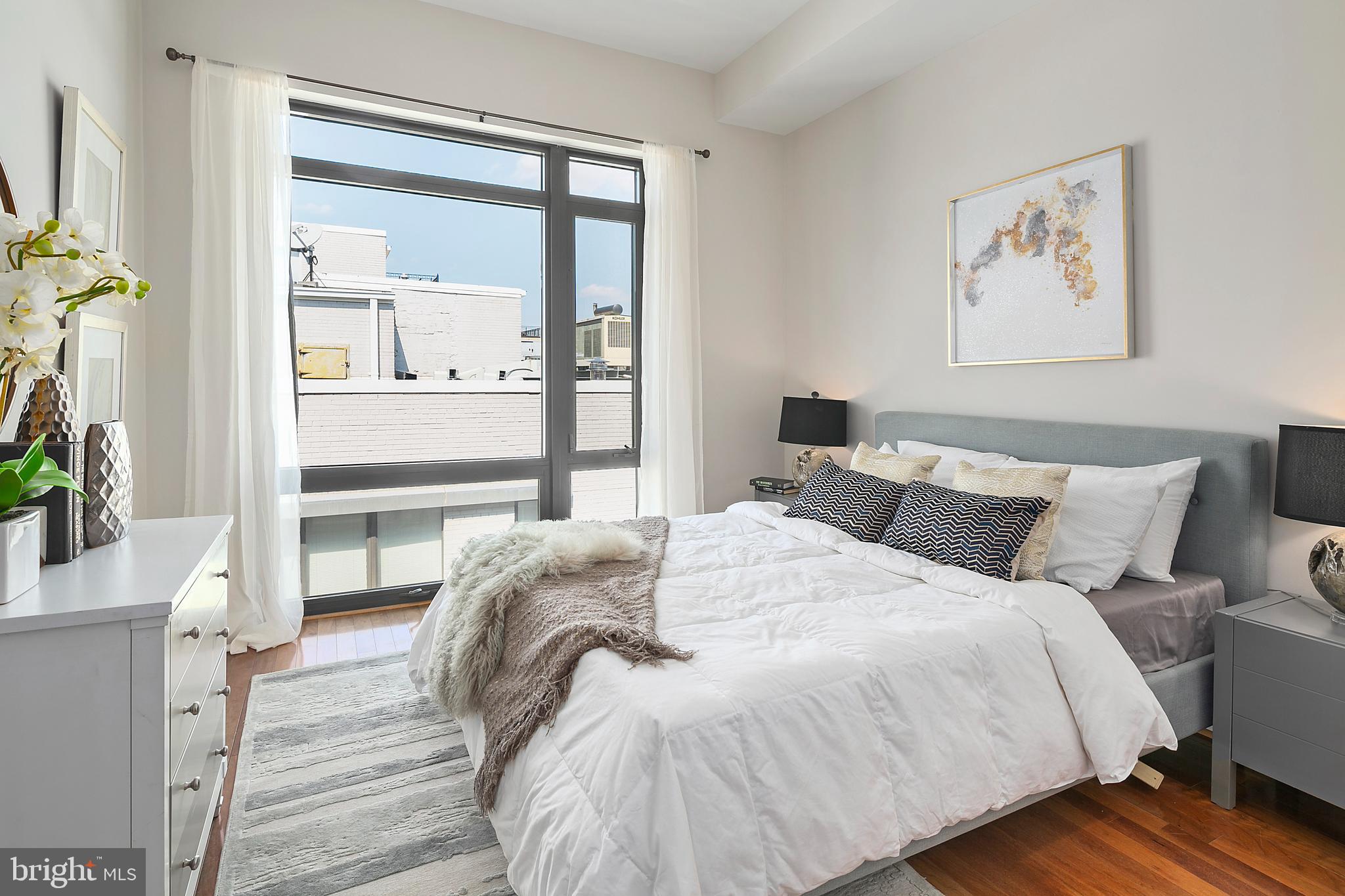 1211 13th Street Northwest, Unit 803 Washington, DC 20005 - Photo 18 of 29 a bedroom with bed and a window