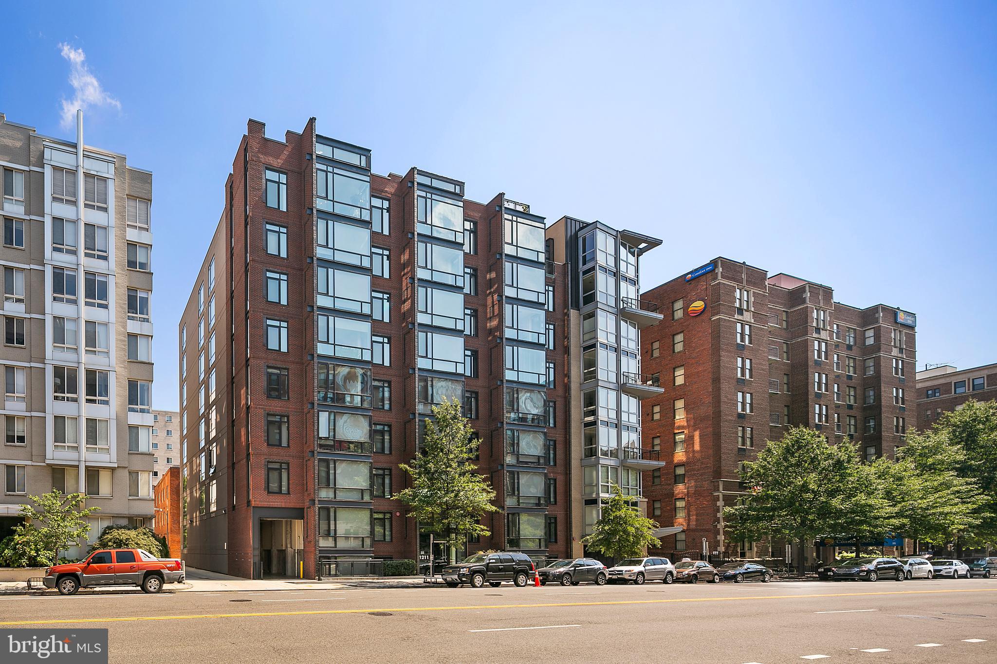 1211 13th Street Northwest, Unit 803 Washington, DC 20005 - Photo 2 of 29 a city street lined with buildings and trees