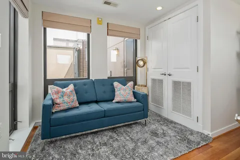 a living room with furniture and a rug
