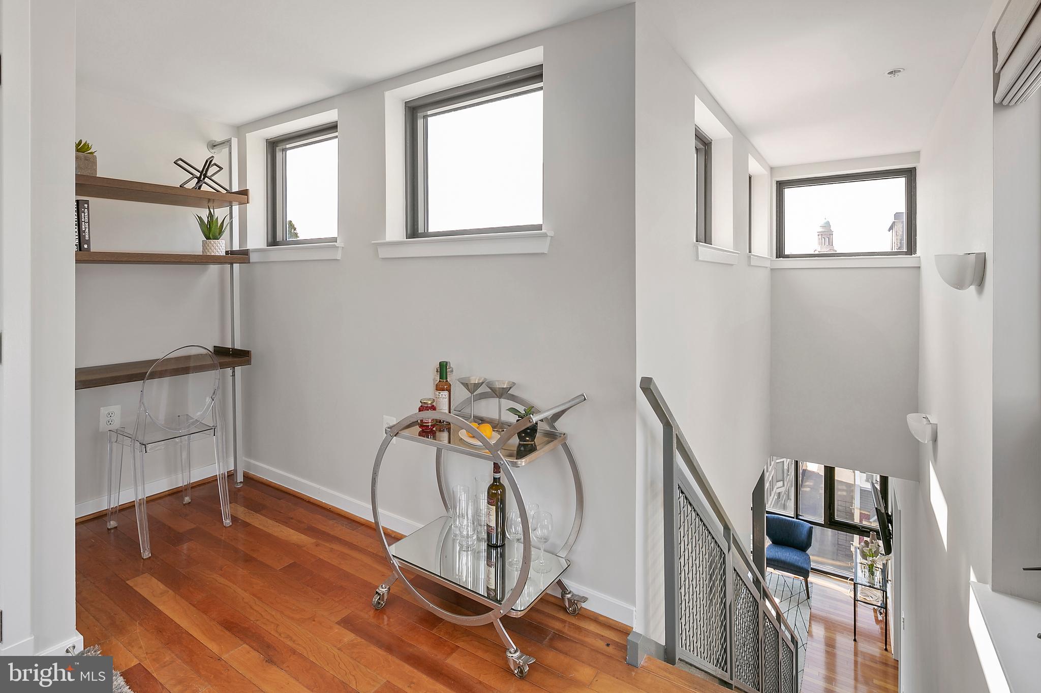 1211 13th Street Northwest, Unit 803 Washington, DC 20005 - Photo 23 of 29 a view of a room with wooden floor and windows