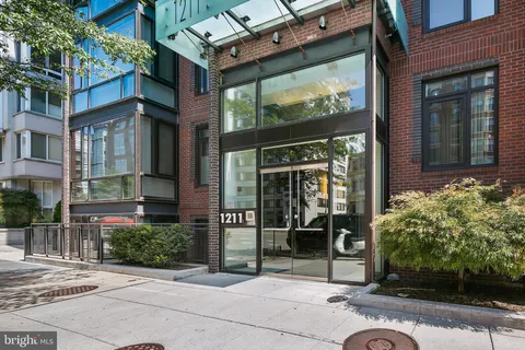 a view of a building with a potted plant windows