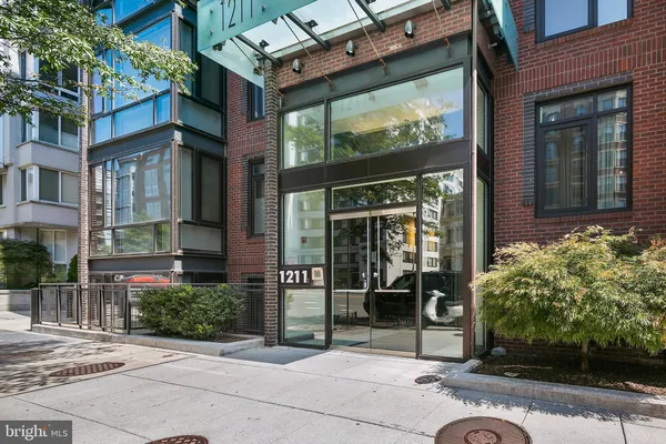 a view of a building with a potted plant windows