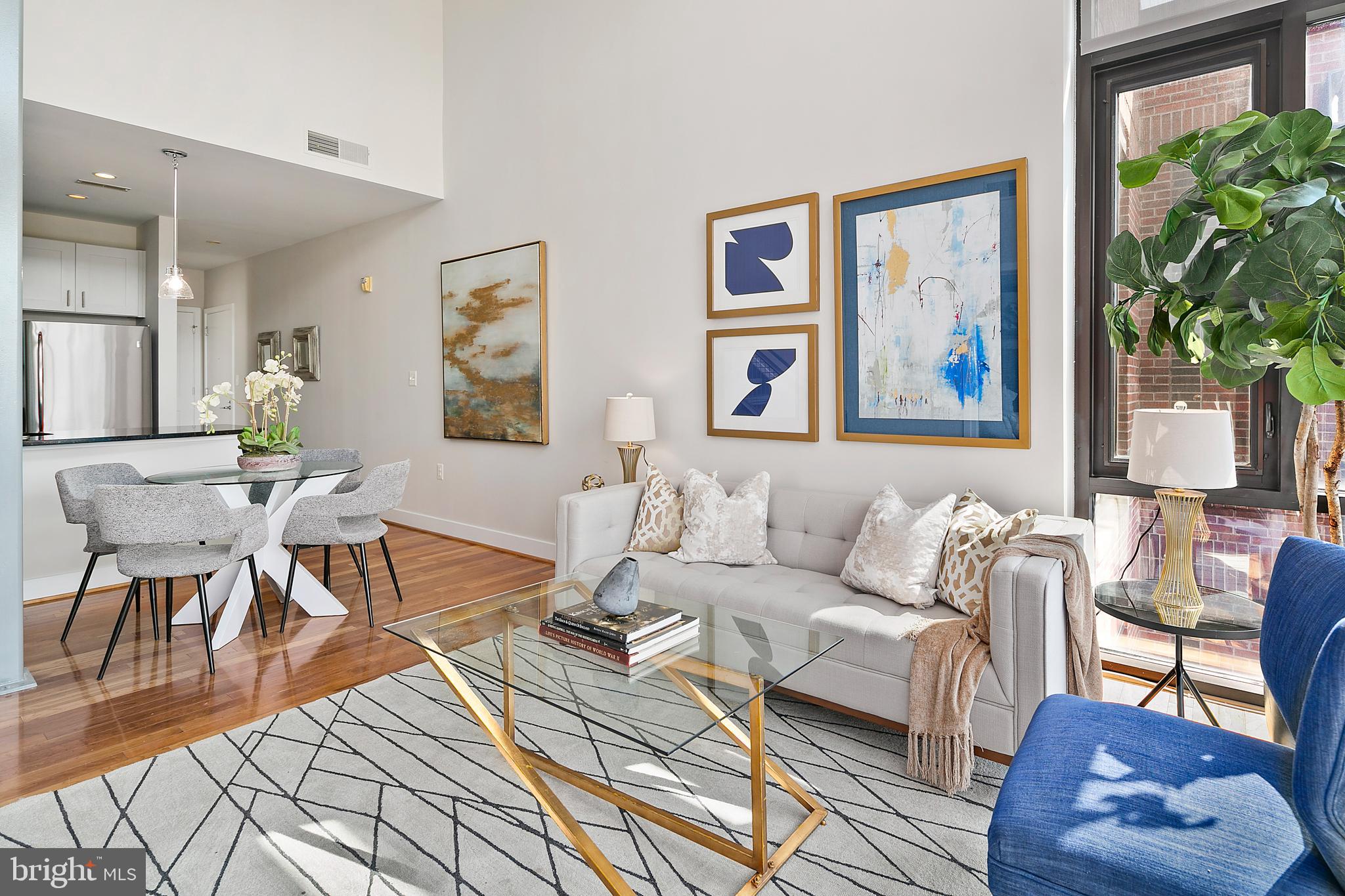 1211 13th Street Northwest, Unit 803 Washington, DC 20005 - Photo 10 of 29 a living room with furniture and a painting on the wall