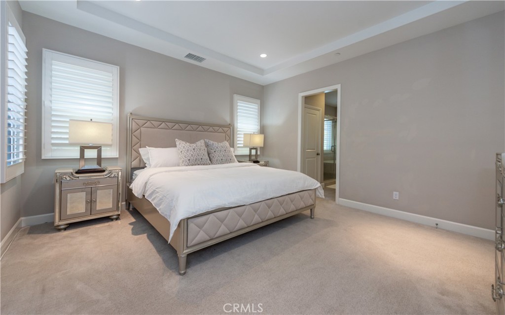 60 Trotter Irvine, CA 92602 - Photo 14 of 24 a bedroom with a bed lamp and a large window