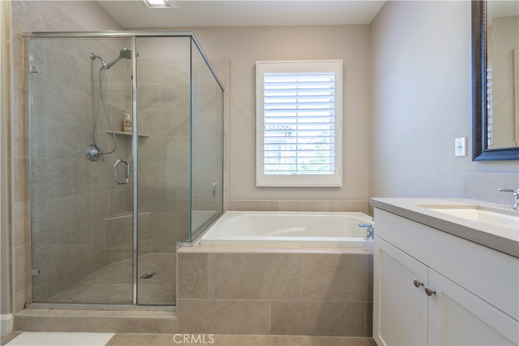 60 Trotter Irvine, CA 92602 - Photo 16 of 24 a bathroom with a bathtub and a shower