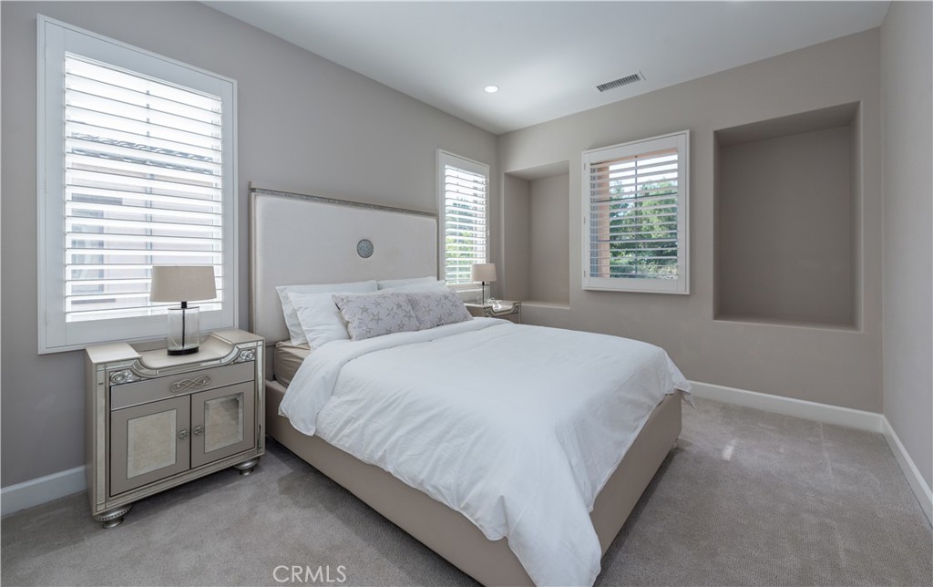 60 Trotter Irvine, CA 92602 - Photo 19 of 24 a spacious bedroom with a bed and a window