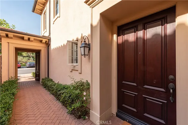 a view of a sign board with buildings in the background