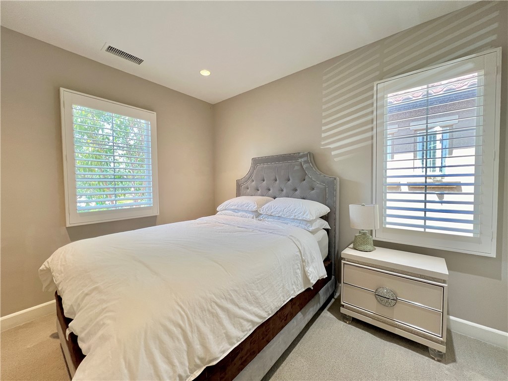 60 Trotter Irvine, CA 92602 - Photo 21 of 24 a bedroom with a bed and a window