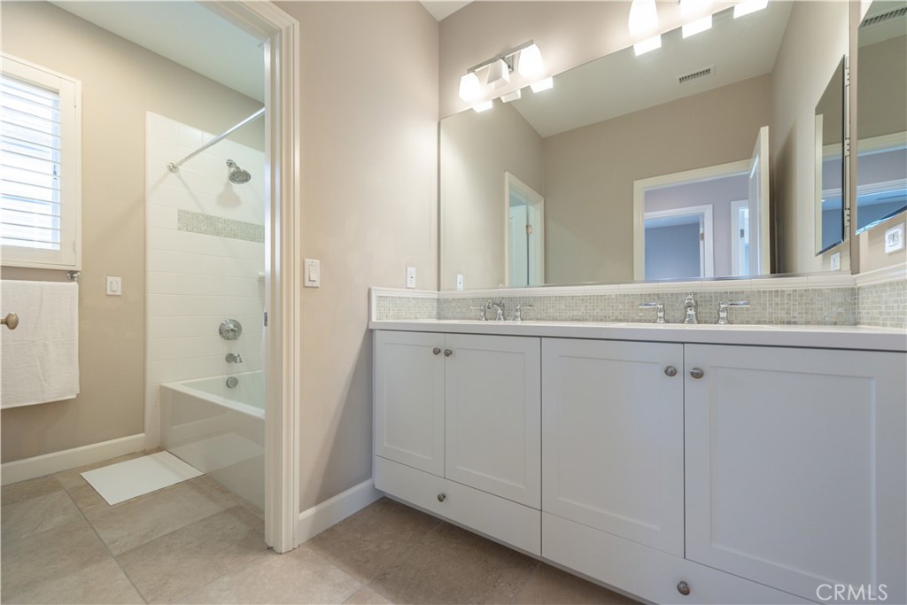 60 Trotter Irvine, CA 92602 - Photo 22 of 24 a view of a bathroom with a granite countertop sink mirror and a
