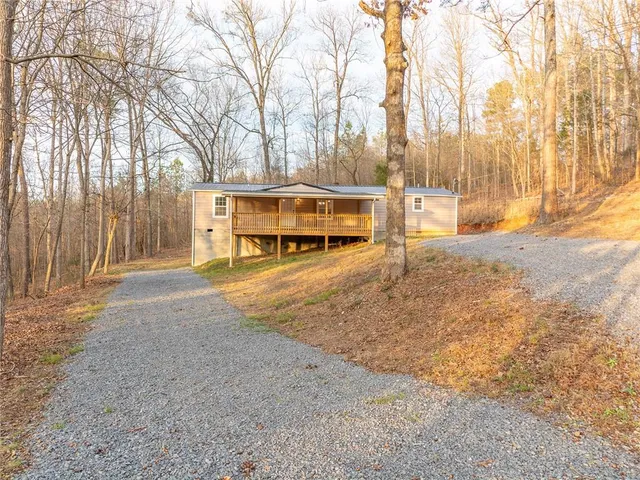 a view of a balcony with wooden floor