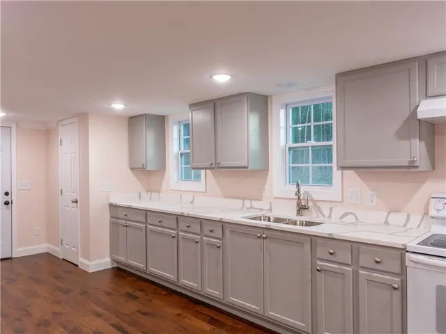 a view of room with wooden floor