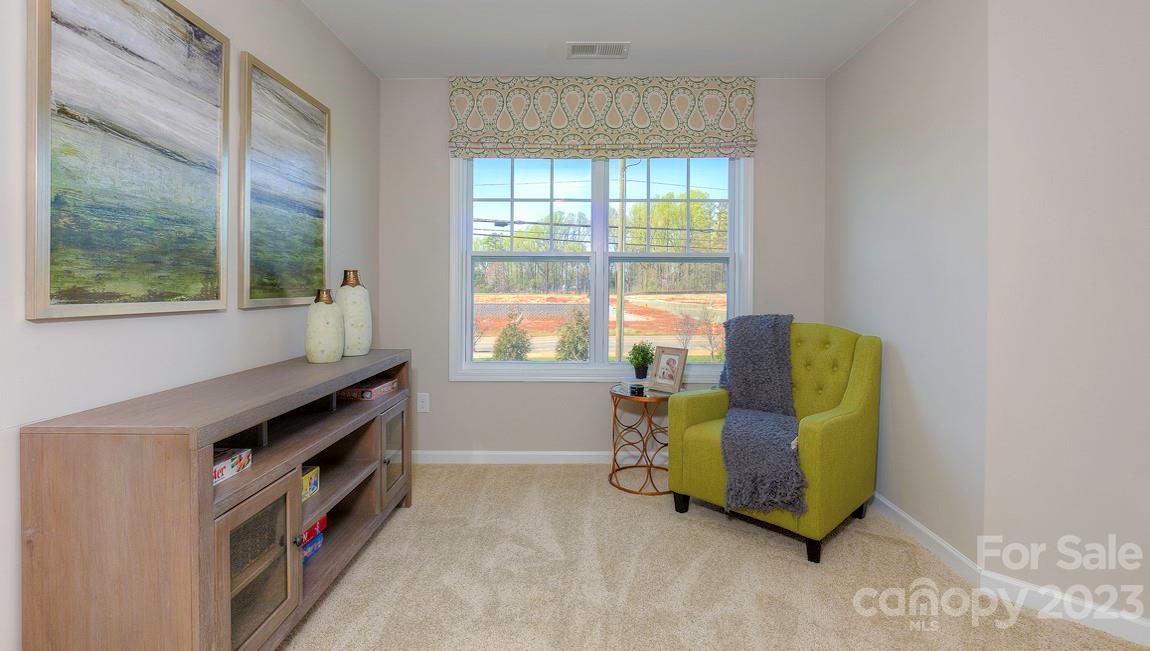 21 Ravens Rdg Road Hendersonville, NC 28792 - Photo 21 of 36 a living room with furniture and a window