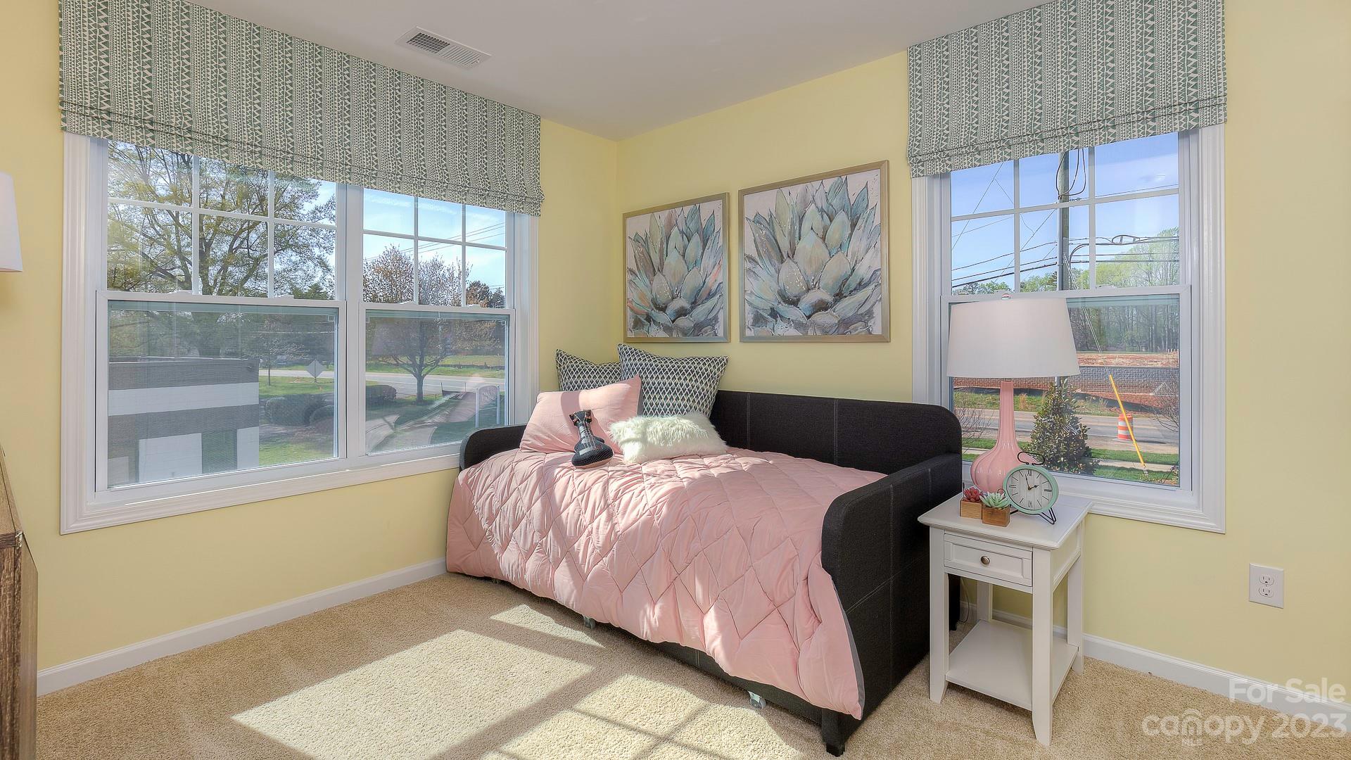 21 Ravens Rdg Road Hendersonville, NC 28792 - Photo 30 of 36 a bedroom with a bed and a painting on the wall