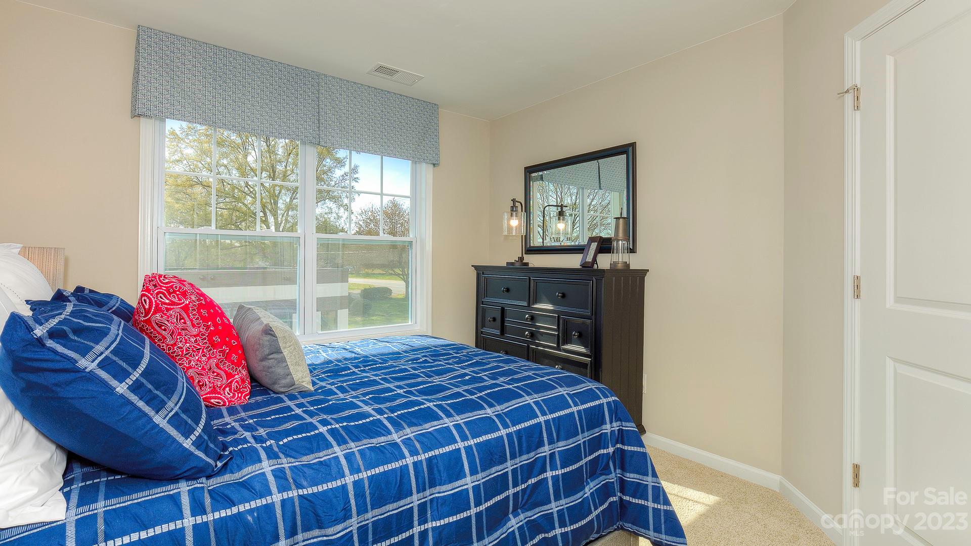21 Ravens Rdg Road Hendersonville, NC 28792 - Photo 34 of 36 a bedroom with a bed closet and window