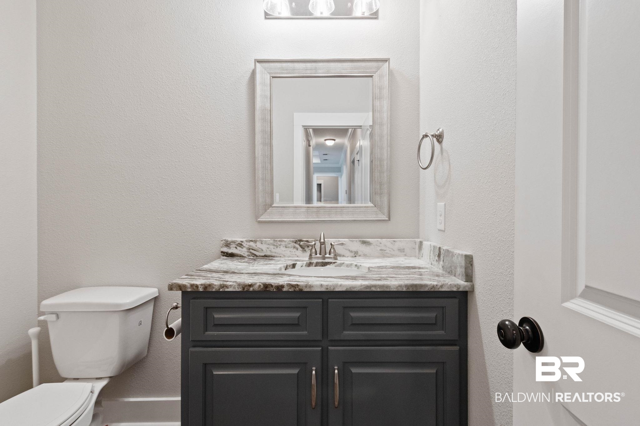 17376 Bankhead Boulevard Fairhope, AL 36532 - Photo 52 of 73 Bathroom with a textured wall and vanity