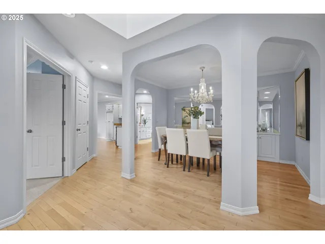 a dining room with furniture and a chandelier