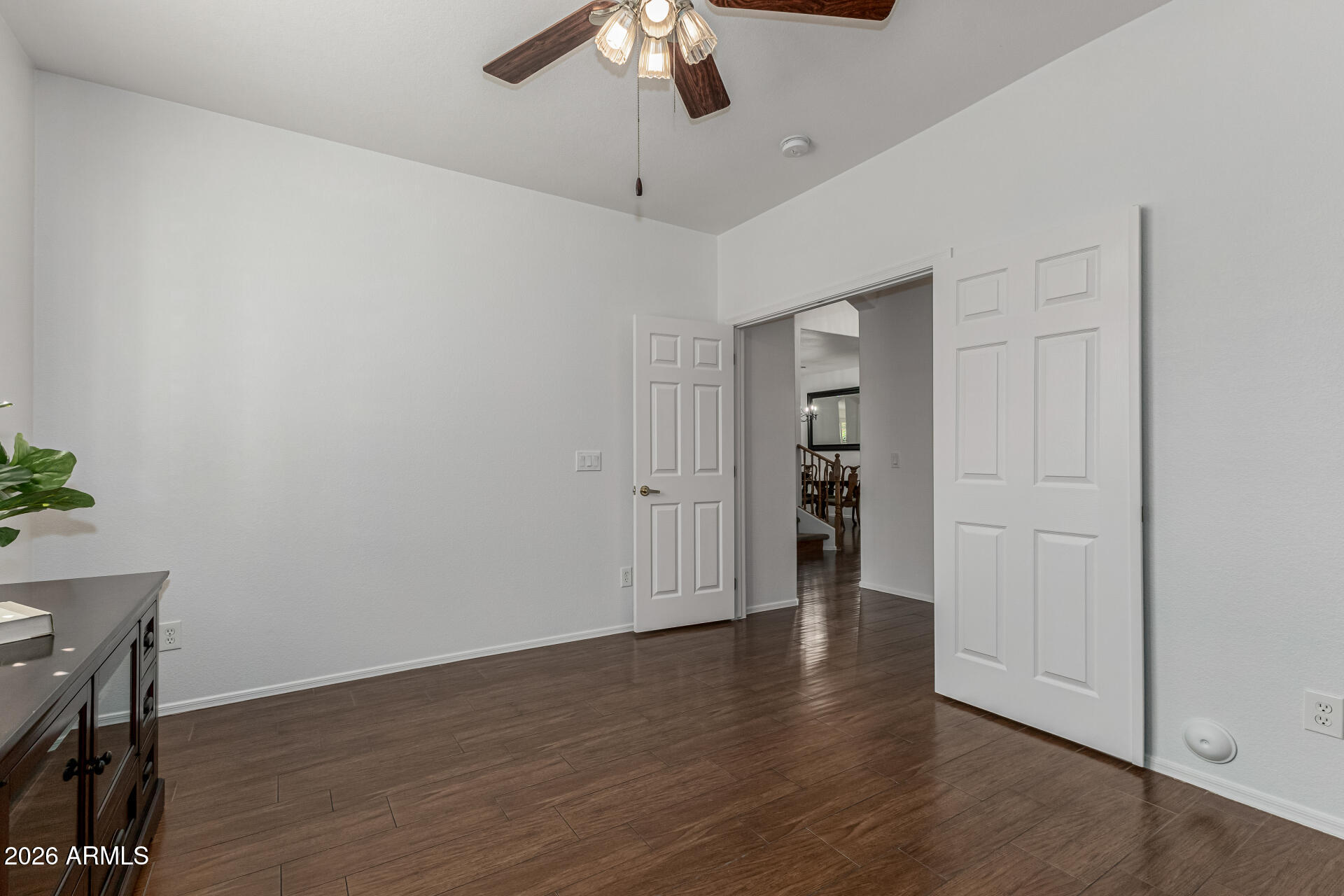 1099 South Justine Court Gilbert, AZ 85296 - Photo 17 of 60 a view of an empty room with wooden floor