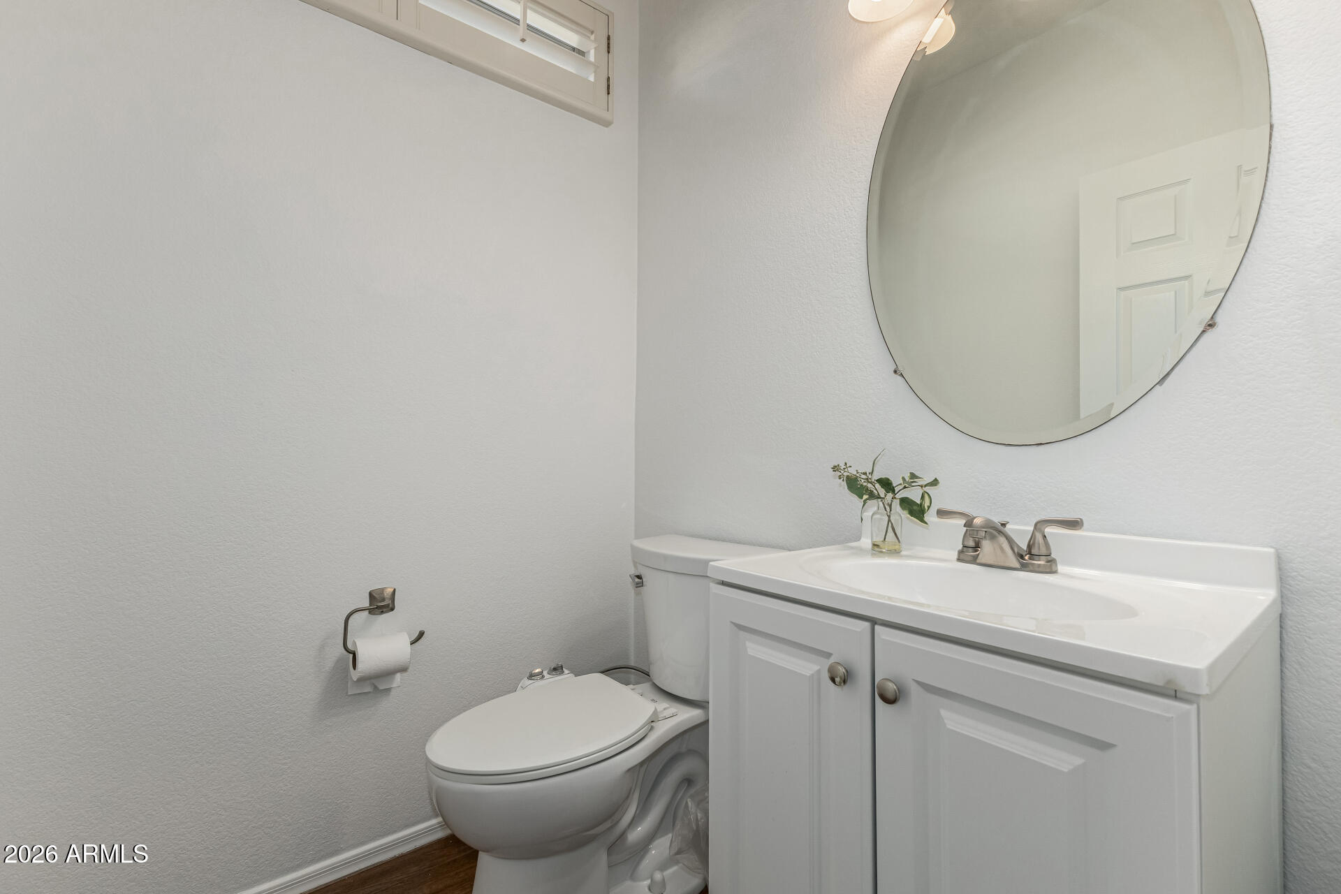 1099 South Justine Court Gilbert, AZ 85296 - Photo 19 of 60 a bathroom with a toilet sink and mirror