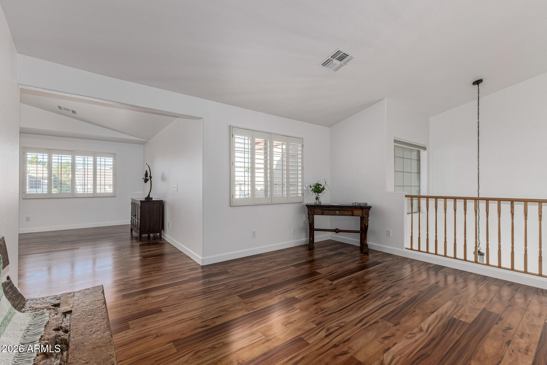 1099 South Justine Court Gilbert, AZ 85296 - Photo 20 of 60 a view of an empty room with window and wooden floor