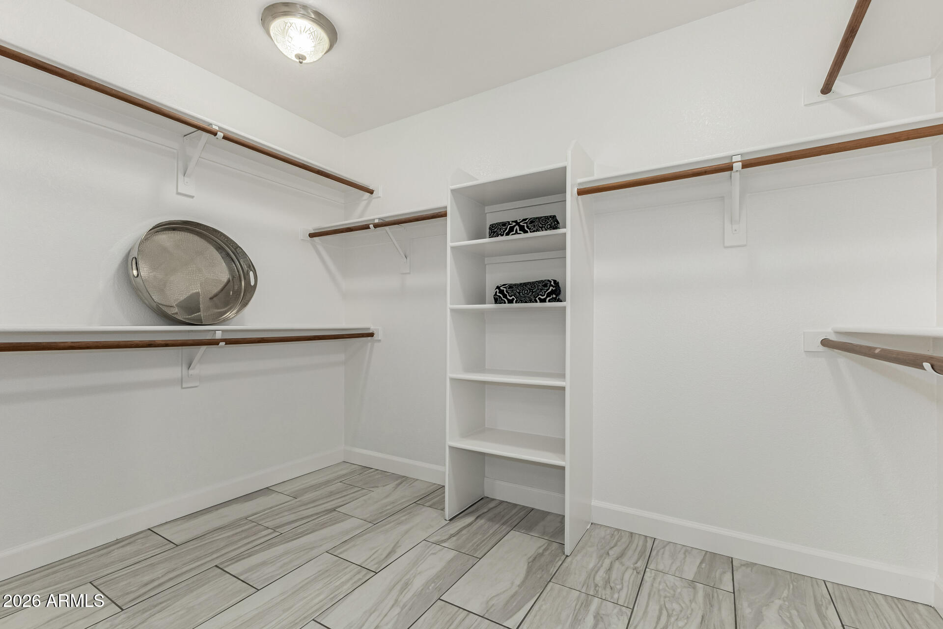 1099 South Justine Court Gilbert, AZ 85296 - Photo 28 of 60 a view of a room with rack on the wall