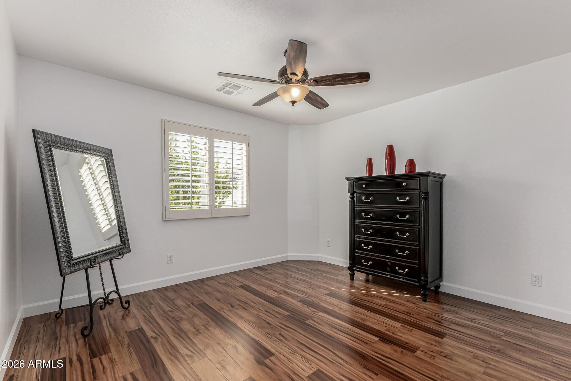 1099 South Justine Court Gilbert, AZ 85296 - Photo 30 of 60 a view of room with wooden floor cabinet and windows
