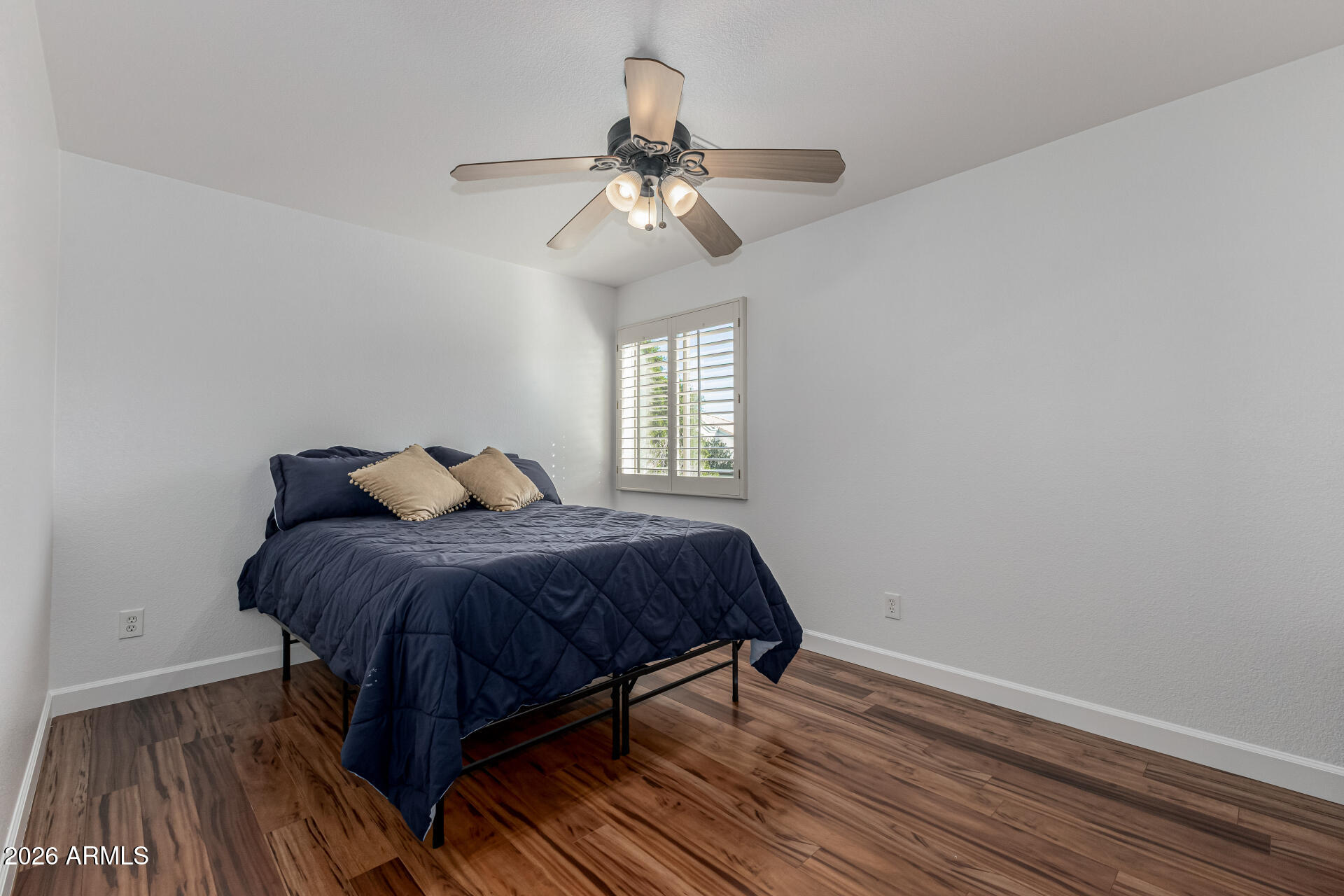 1099 South Justine Court Gilbert, AZ 85296 - Photo 35 of 60 a bedroom with a bed and window