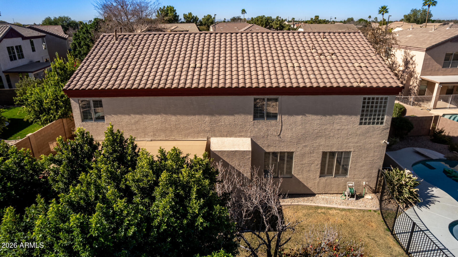 1099 South Justine Court Gilbert, AZ 85296 - Photo 51 of 60 an aerial view of a house with a garden