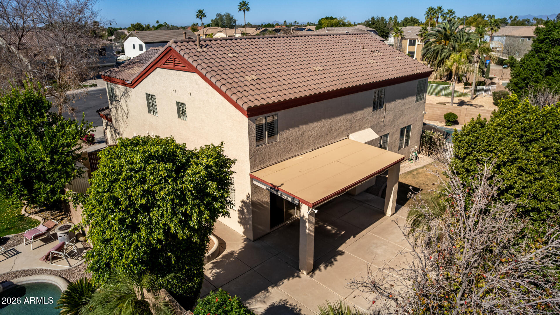 1099 South Justine Court Gilbert, AZ 85296 - Photo 52 of 60 an aerial view of a house with a yard and furniture