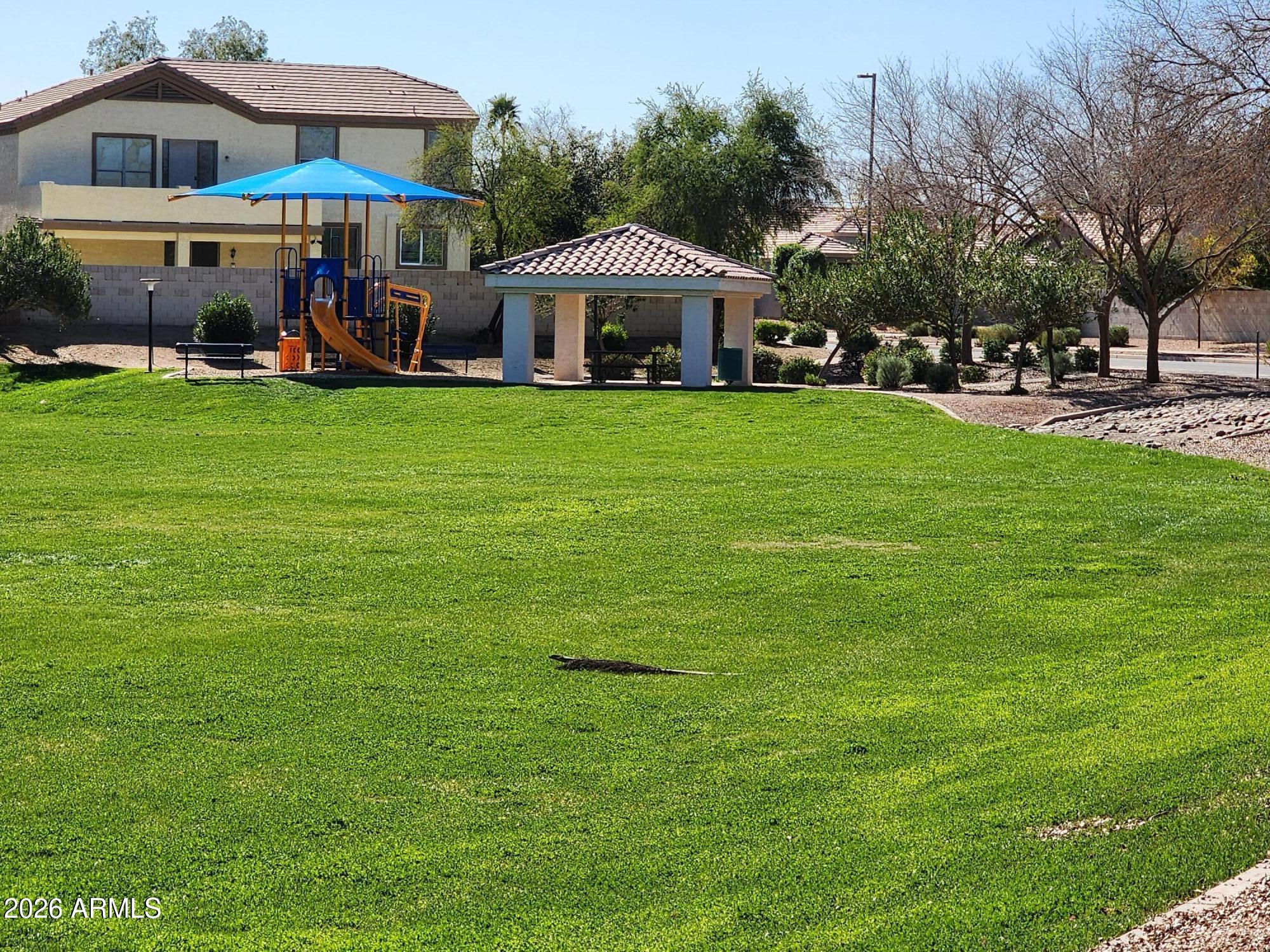 1099 South Justine Court Gilbert, AZ 85296 - Photo 55 of 60 a view of a house with a yard and sitting area