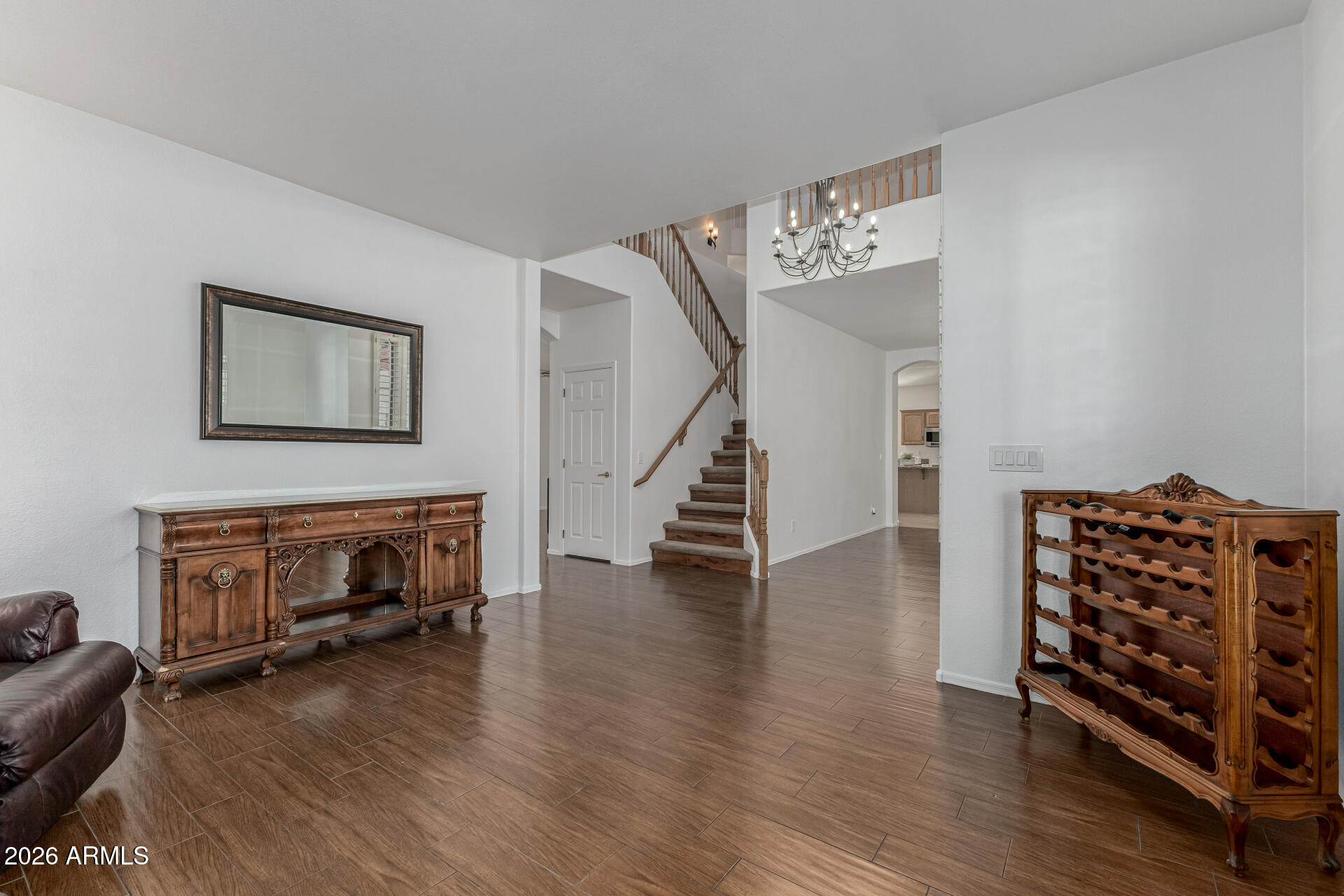 1099 South Justine Court Gilbert, AZ 85296 - Photo 4 of 60 a view of livingroom with hardwood floor and a ceiling fan