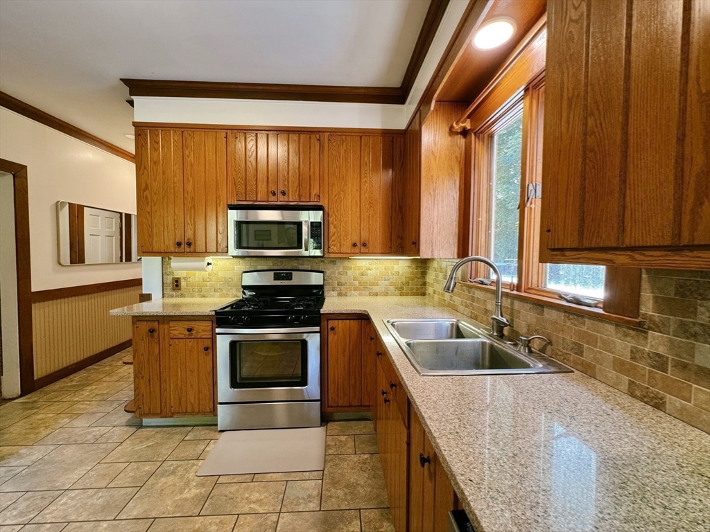 169 Palmer Road Monson, MA 01057 - Photo 18 of 33 a kitchen with a sink stove and microwave