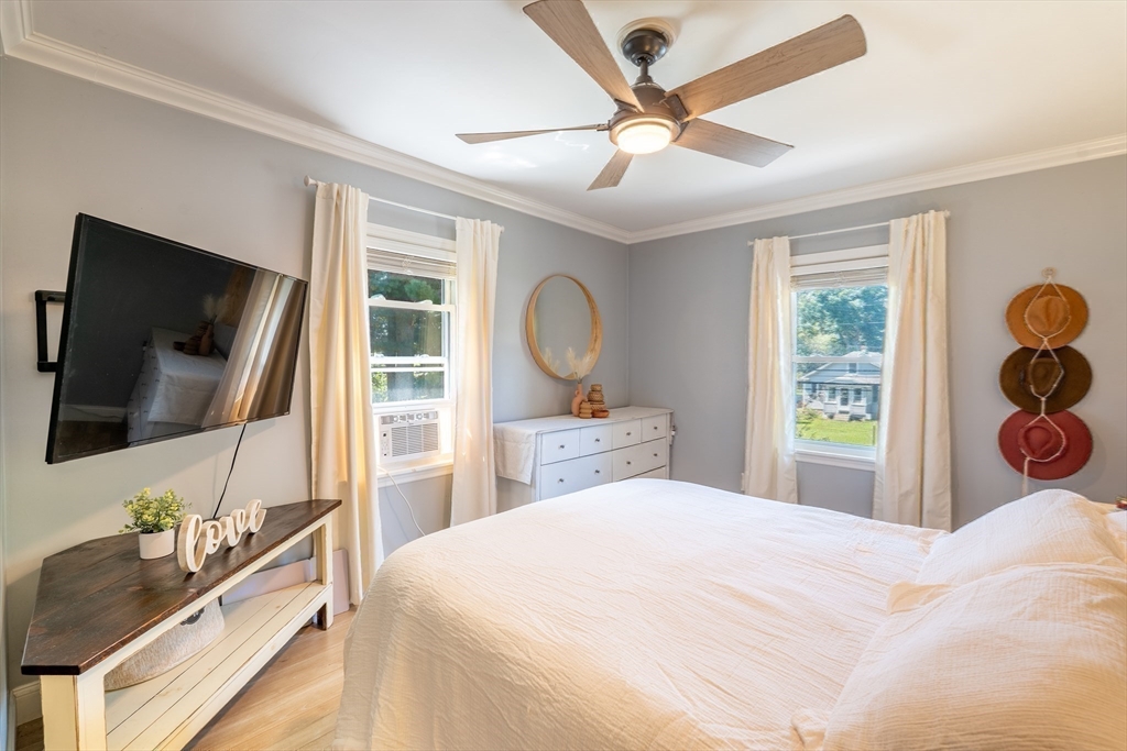 169 Palmer Road Monson, MA 01057 - Photo 23 of 33 a bedroom with a bed and a flat screen tv