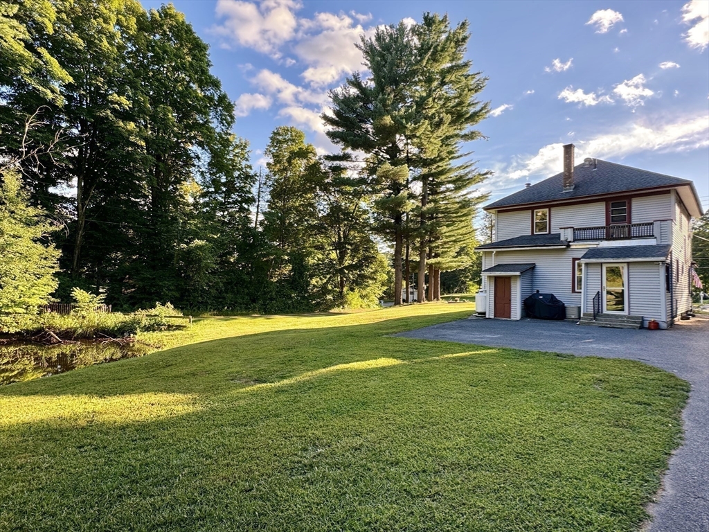 169 Palmer Road Monson, MA 01057 - Photo 10 of 33 a view of a house with a yard