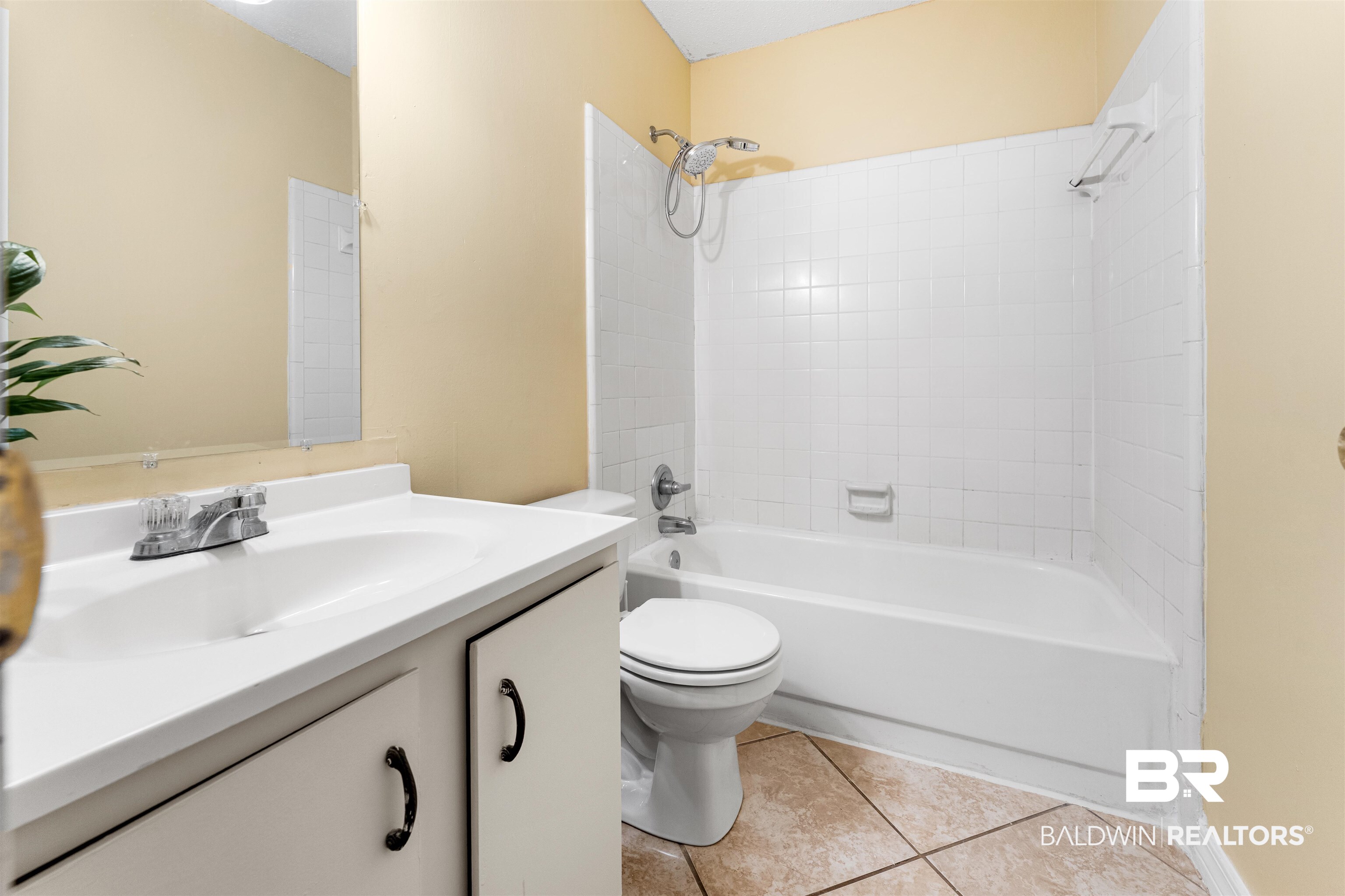 5551 Springer Court Theodore, AL 36582 - Photo 35 of 37 Full bathroom with bathtub / shower combination, vanity, and light tile patterned floors
