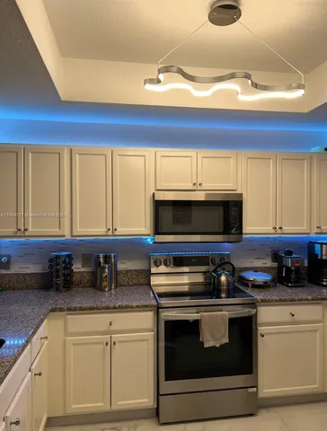 a kitchen with a stove and a microwave