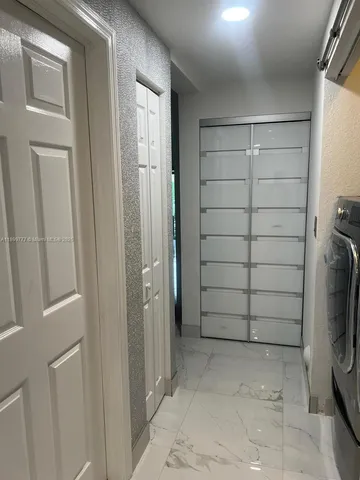 a bathroom with a shower and a sink