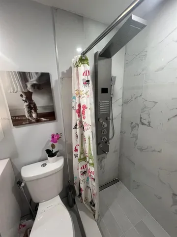 a bathroom with a sink toilet and vanity