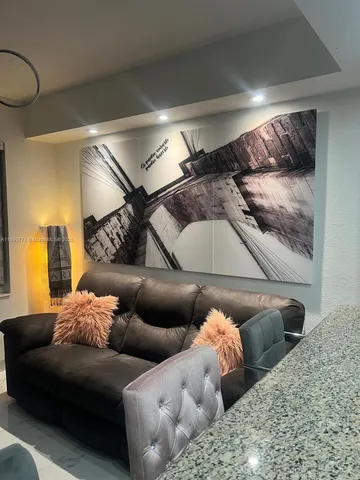 a living room with furniture and a couch