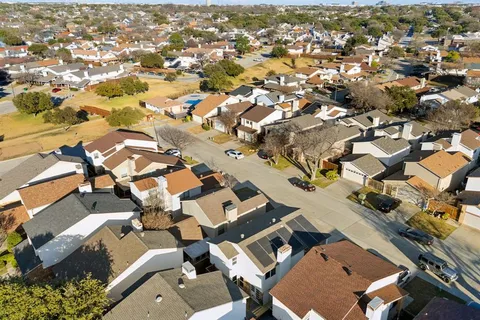 an aerial view of a city with lots of residential buildings