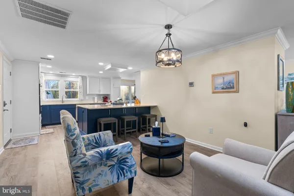 a living room with furniture or couch and a dining table